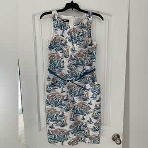 Sailboat dress with blue belt.